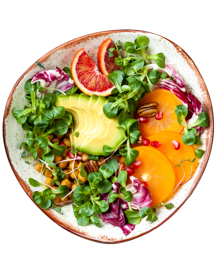 Vegane Bowl mit Avocado und Blutorange Frische Bowl mit Avocado, Blutorange, Feldsalat, Kichererbsen, Persimone, Radicchio und Pekannüssen auf Keramikteller.